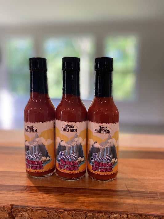 Introducing Blessed Family Farm Smoky Berbere Hot Sauce. You will immediately intrigued by the boldness and mystique of the Berbere spice. Expect to taste wood smoked herbs and spices with a hint of aged rum. This hot sauce is perfect balance of flavor and heat.  Rates as Medium on the Heat Scale